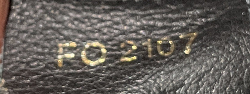 Louis Vuitton Triangle Softy Bag in Reverse Monogram Canvas
